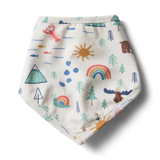 A triangular baby bib with an off-white background, decorated with a colorful nature-themed and Maine inspired print including rainbows, suns, mountain peaks, evergreens, bears, moose, lobsters, and blueberries .