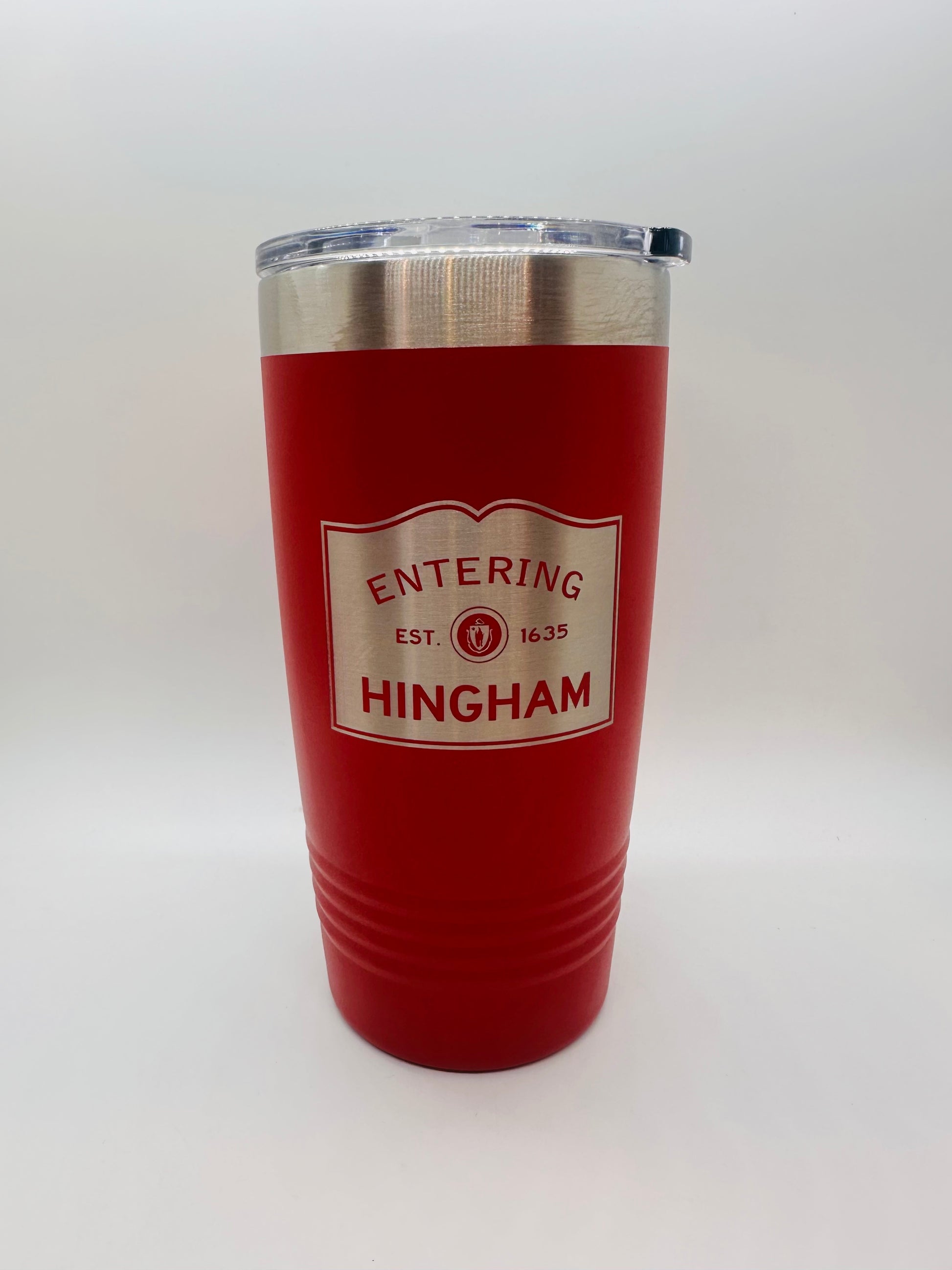 A red insulated metal tumbler with silver etching and text 'ENTERING HINGHAM EST 1636' on the front.
