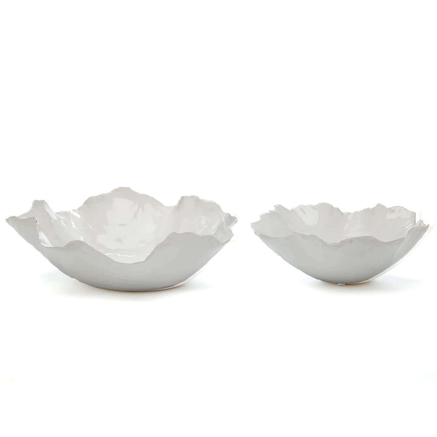 Two white ceramic bowls(large and small) with a textured surface on a white background.  Artistic irregular shaped edges