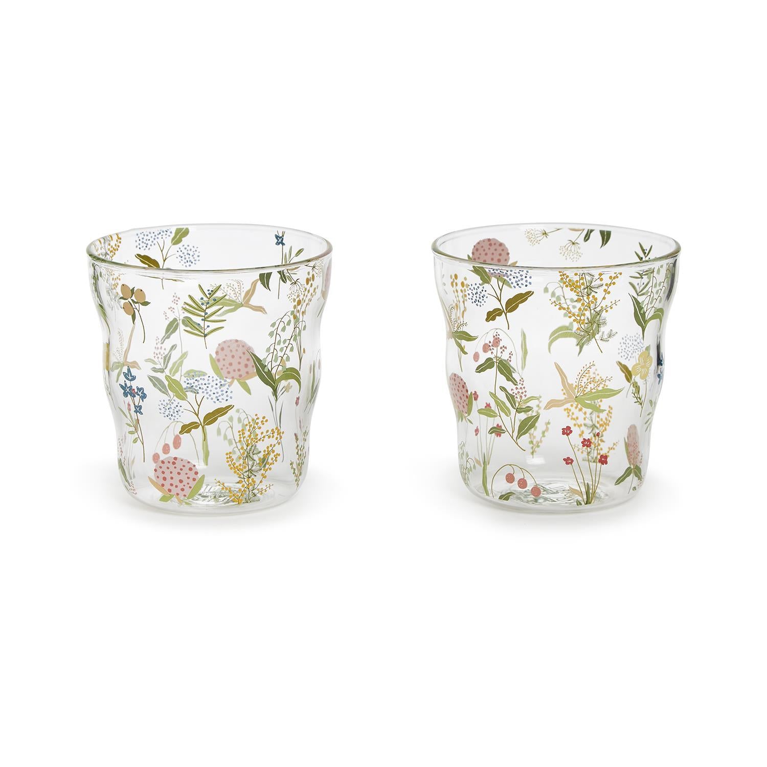 Two rocks glass with floral pattern on a white background