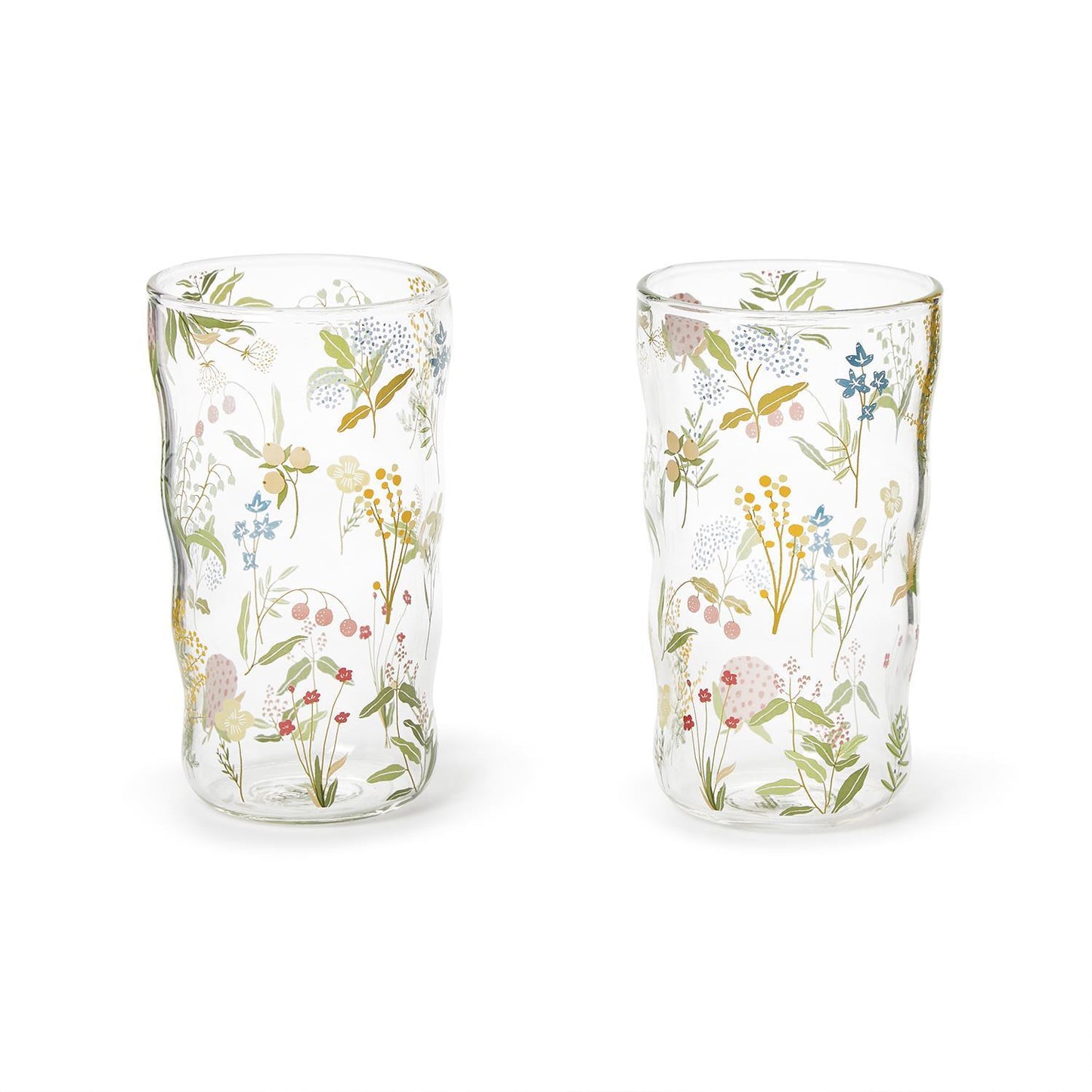 Two clear glass tumblers with floral patterns on a white background