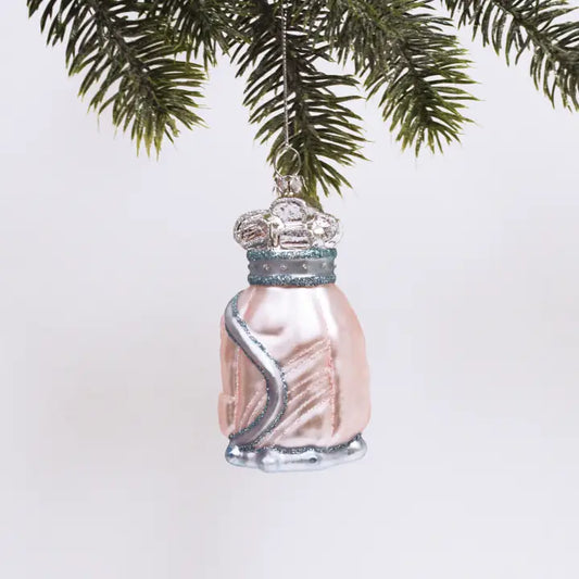 Glass golf bag Ornament that is pink and has sparkles on it