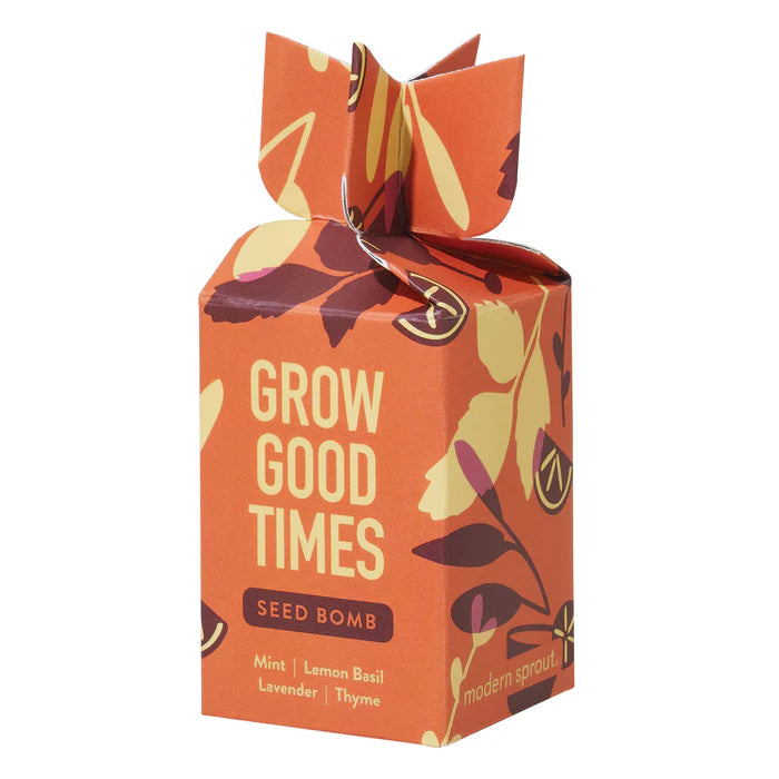 Seed bomb in orange box with "grow good times" in yellow print and burgundy and yellow leaves from Modern sprout