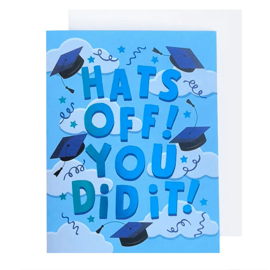 Graduation-themed card the reads "Hats off! You did it !" printed in Blue with graduation hats flying on a sky blue background with light blue clouds, blue swirls and star