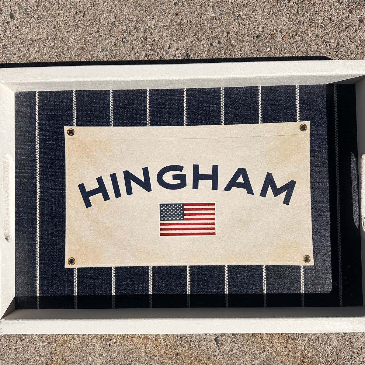 White Wooden Tray with navy nautical style stripes and a vintage flag that states HINGHAM with an American flag on surface