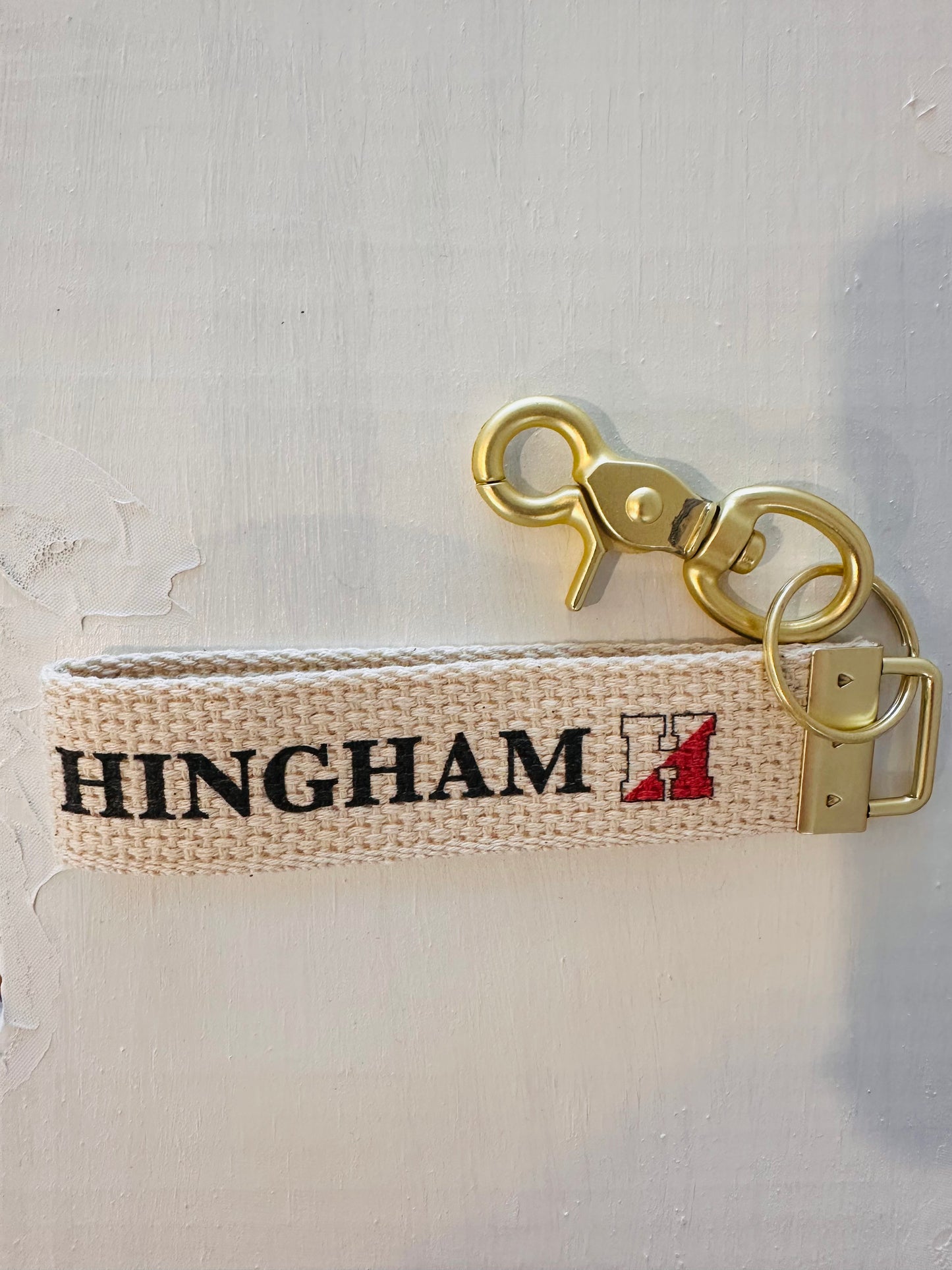 Canvas Key Chain with Hingham in Black and 'H' Logo in Black and Red.  Brass hook
