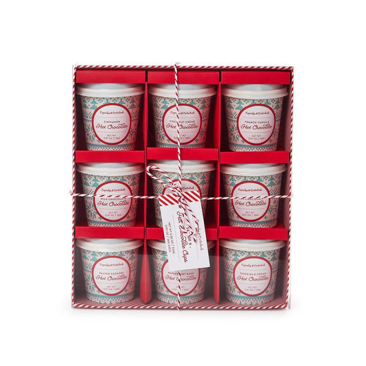 Set of six hot chocolate cups in a decorative box with a tag.