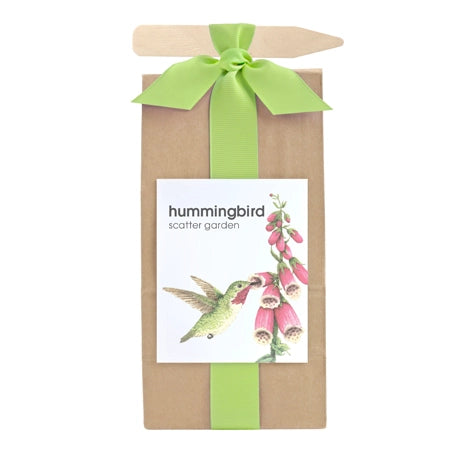 Kraft Bag with Green Ribbon and label that states hummingbird garden with image of hummingbird and flowers