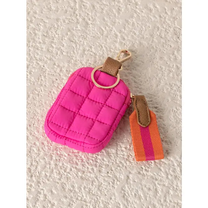 Magenta quilted clip on coin pouch with brass clip and orange and magenta canvas zip tab