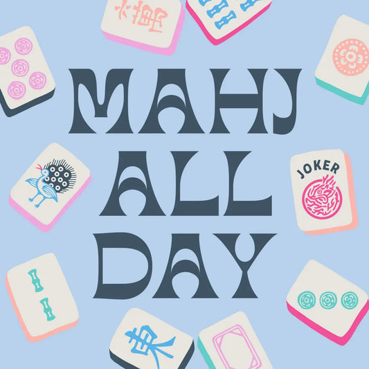 'MAHJ ALL DAY' text surrounded by stylized mahjong tiles on a light blue cocktail napkin.