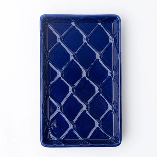 Blue rectangular ceramic napkin holder with lattice pattern on a white background