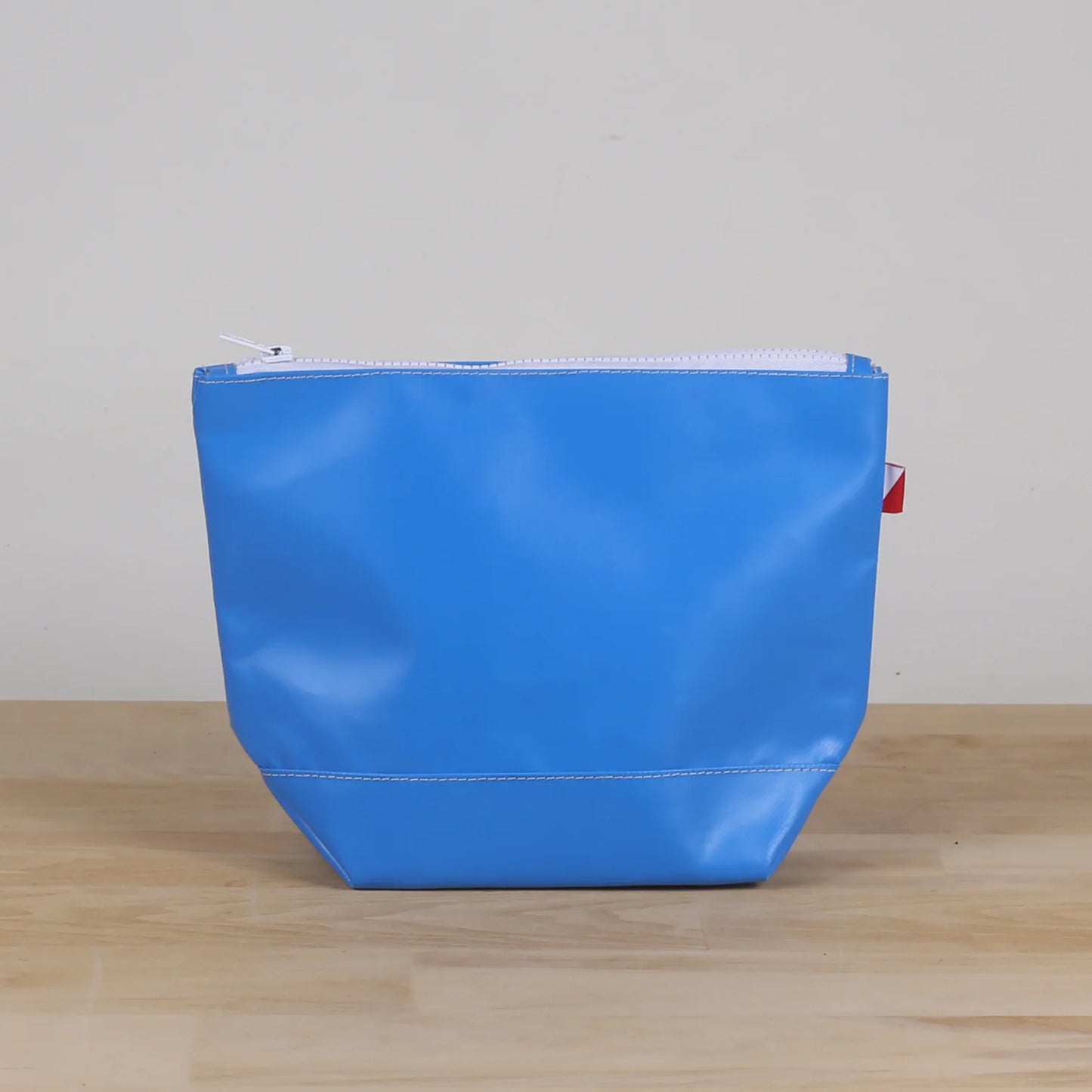 Blue Pouch with water resistant material and white zipper