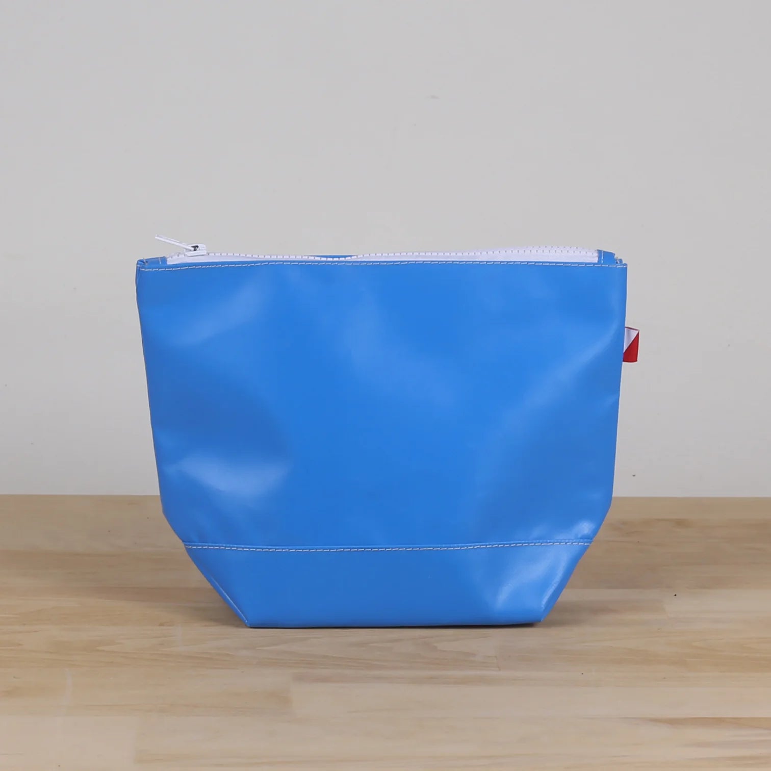 Blue Pouch with water resistant material and white zipper