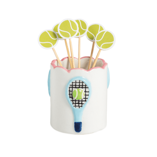 Tennis-themed toothpick holder with tennis ball picks in a scalloped ceramic holder with light blue tennis rackets painted on it 