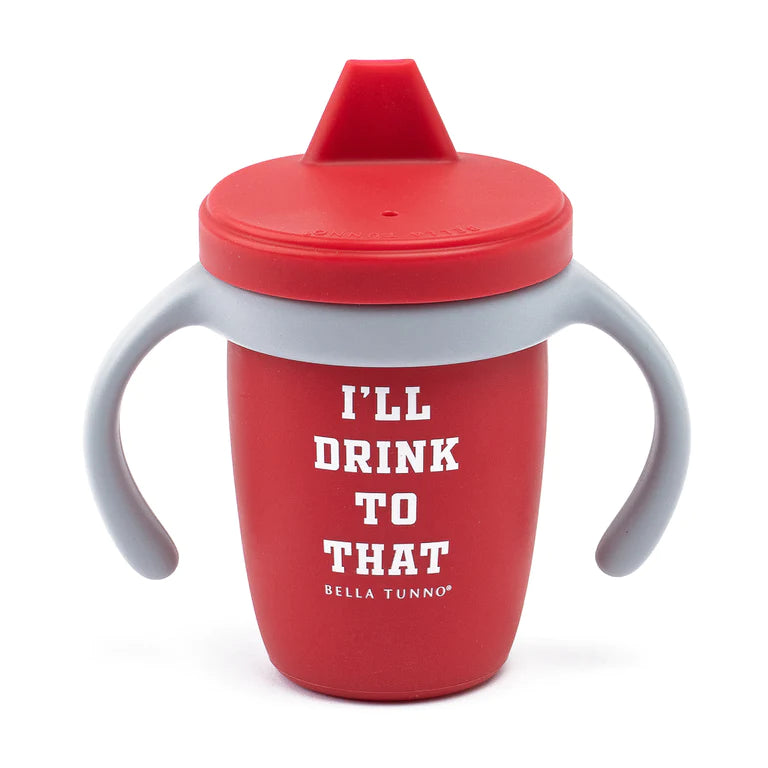 Red food grade silicone sippy cup with light gray handles and white text that reads "I'll drink to that" printed on front by Bella Tunno 