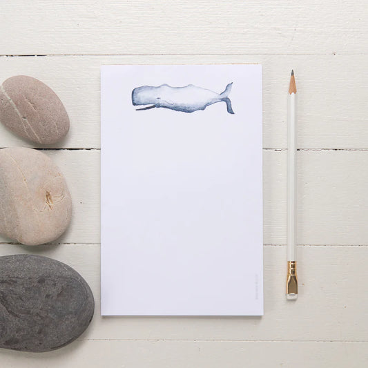 tear away notepad with blue sperm whale at the top center