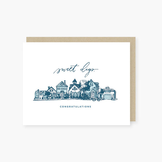 Greeting card with 'sweet digs' and 'Congratulations' text, featuring a small town illustration.
