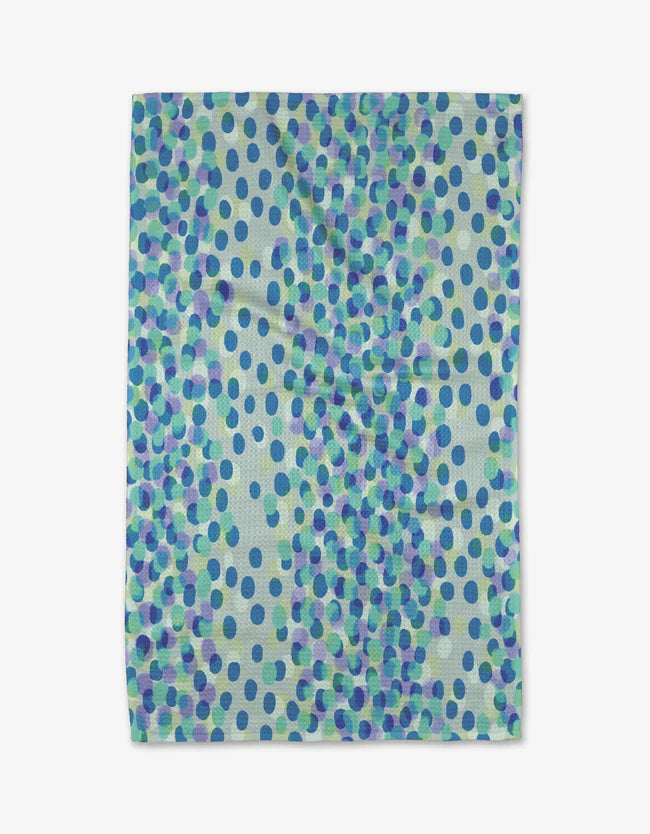kitchen towel with a variety of shades of blue spots