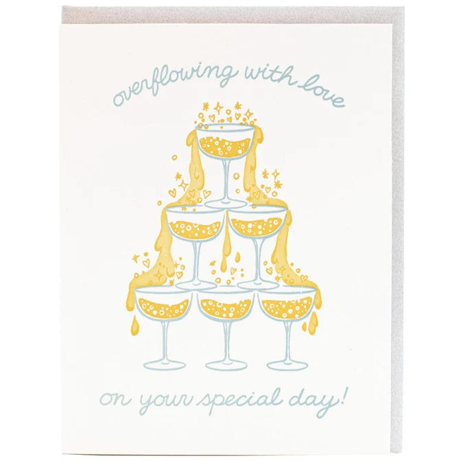 Wedding card with champagne glass tower illustration and text 'overflowing with love'