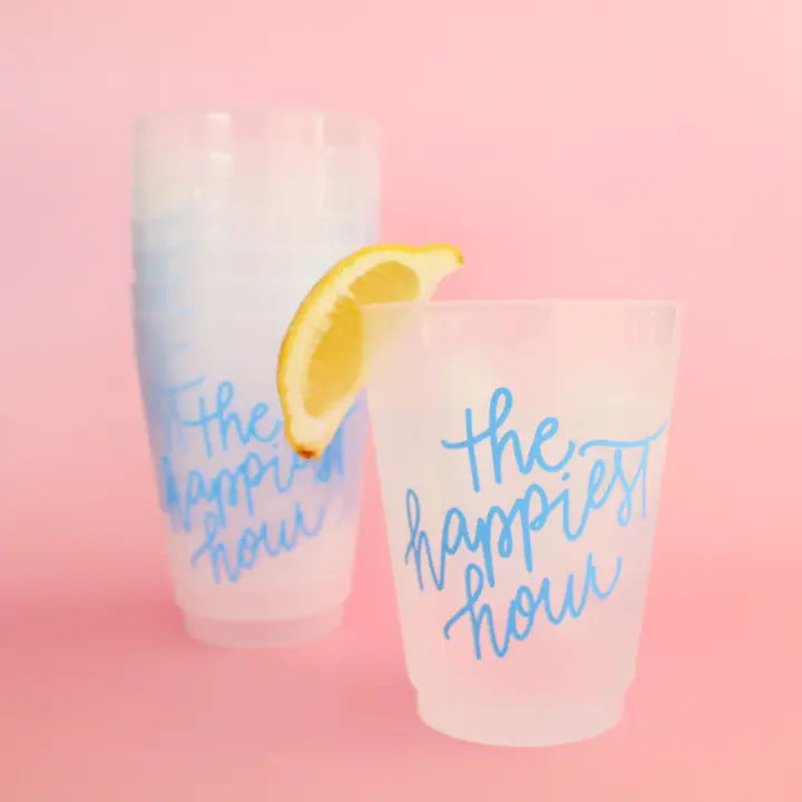 Clear cup with blue cursive writing