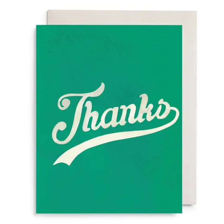 Greeting card with green background and the word 'Thanks' in white, cursive, text in the center