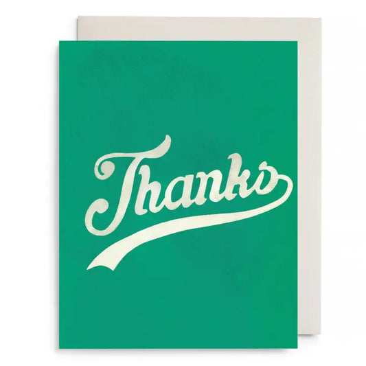 Greeting card with green background and the word 'Thanks' in white, cursive, text in the center