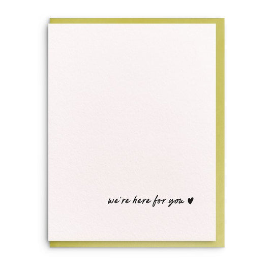 White sympathy card with black cursive letters and a small black heart in the bottom right corner.