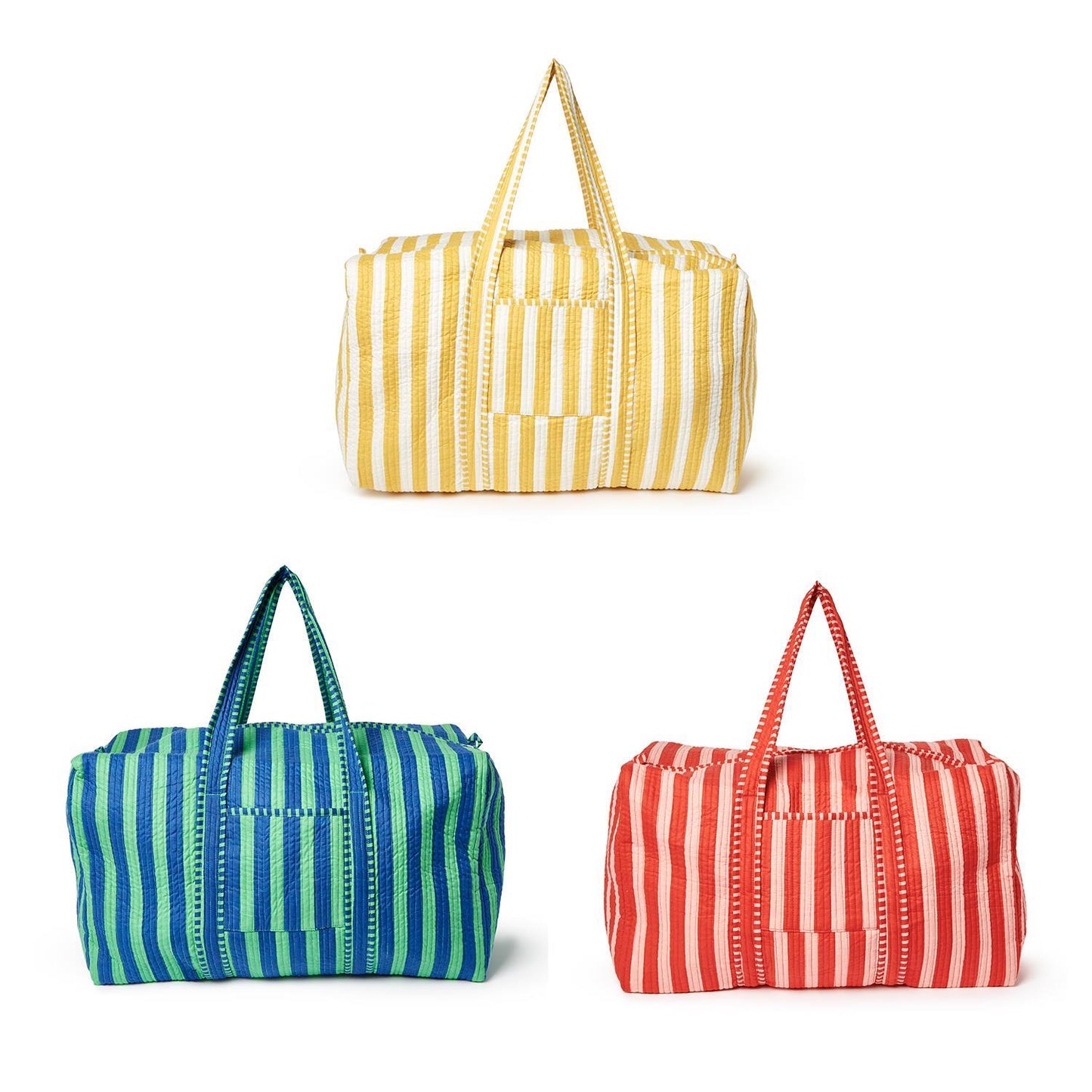 Three striped weekend bags in yellow/white, blue/green, and red/pink on a white background
