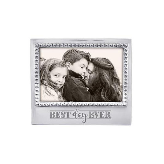 Silver horizontal frame with cursive words on the bottom and a beaded edge all around it