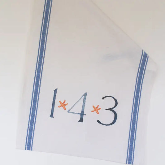 Tea Towel with watercolor of 143. starfish are located inbetween the 143.  towel has blue vertical stripes