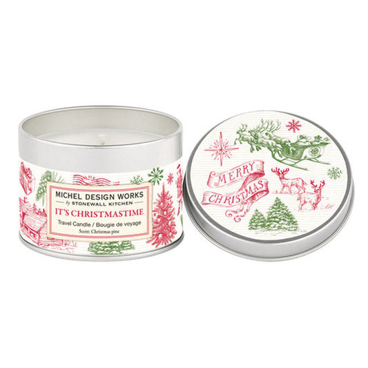 travel candle in tin with label that has christmas etching