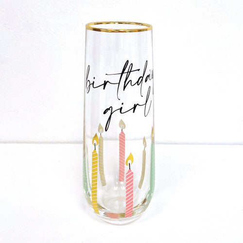 champagne glass with gold rim birthday girl in script candles are multi color pastel