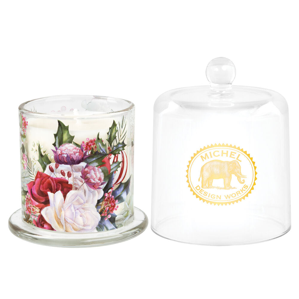 glass candle with cover label has image of winter flowers white green marroon