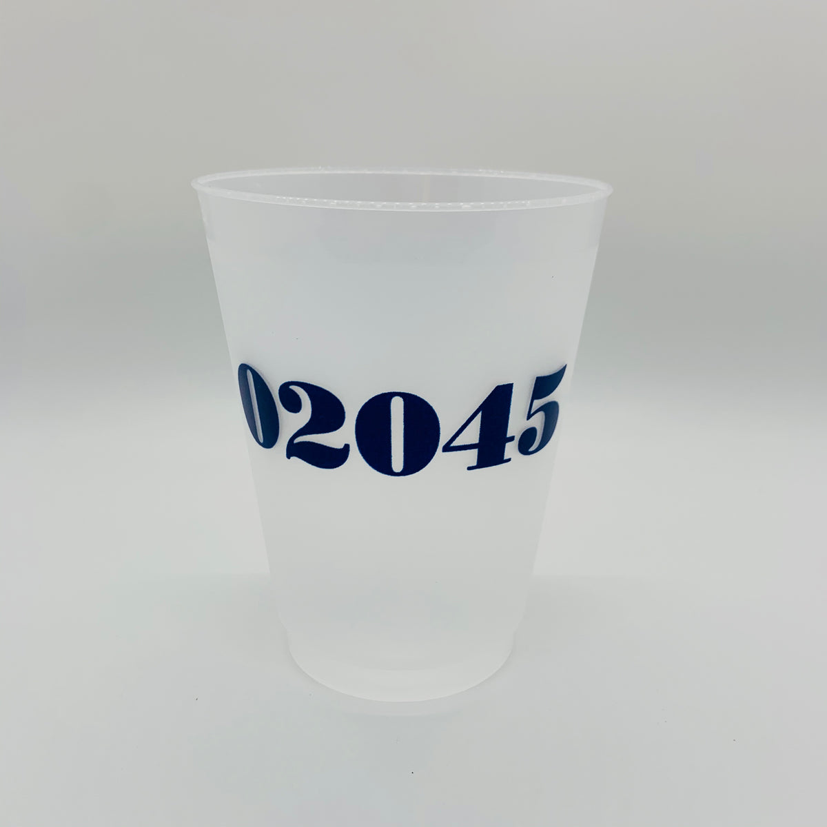 A clear plastic disposable cup with navy blue text '02045' printed on it.