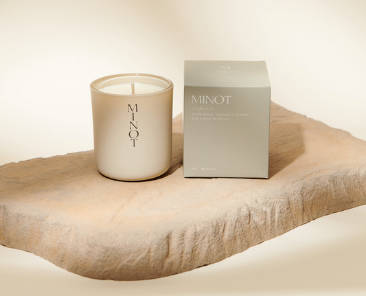 Minot candle cliffwalk with candle box in a neutral background