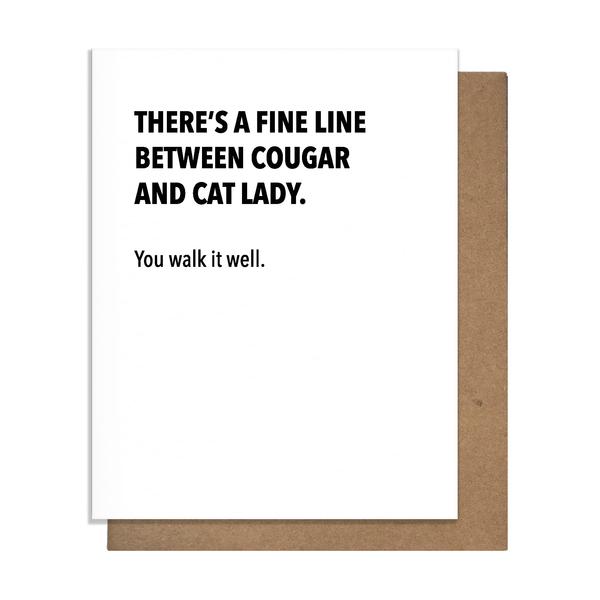 White card with black letters at the top