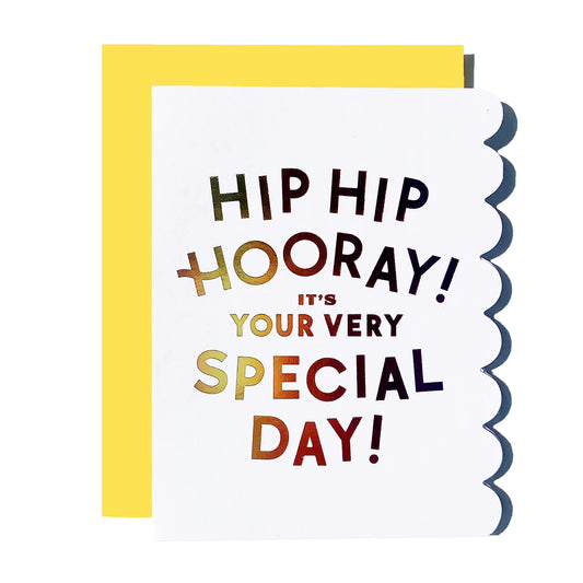 White card with gold letters on it