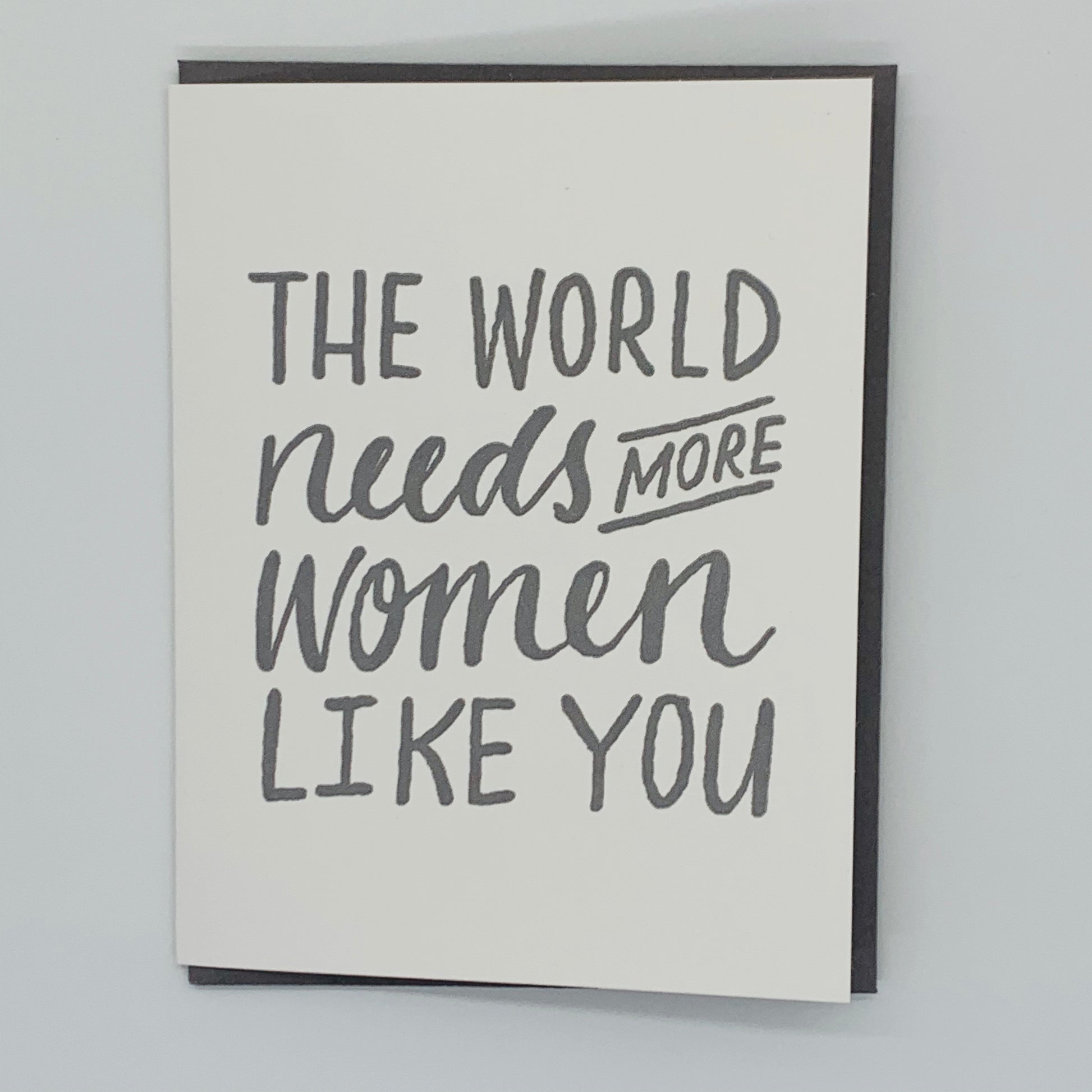 White Greeting Card with the text 'The World Needs More Women Like You' with gray envelope