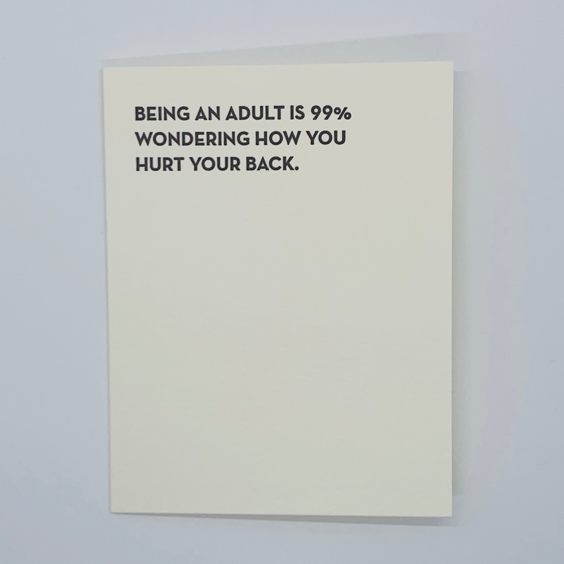 single card.  black text.  Being an adult is 99% wondering how you hurt your back