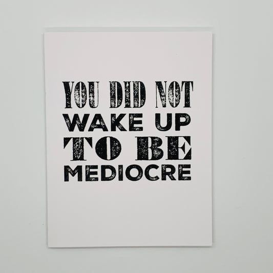white card with 'you did not wake up to be mediocre' in black on front