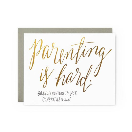 White greeting card with gold text that says, "Parenting is Hard. Grandparenting is Not. Congratulations!"