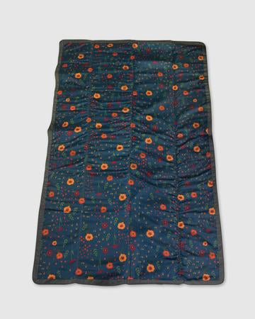 This mid-size, water-resistant blanket is great for both outdoor and indoor play. Its  bag-less, compact fold makes packing up quick and easy and an adjustable carrying strap and a pocket makes this on-the-go blanket a true stroller and trunk essential